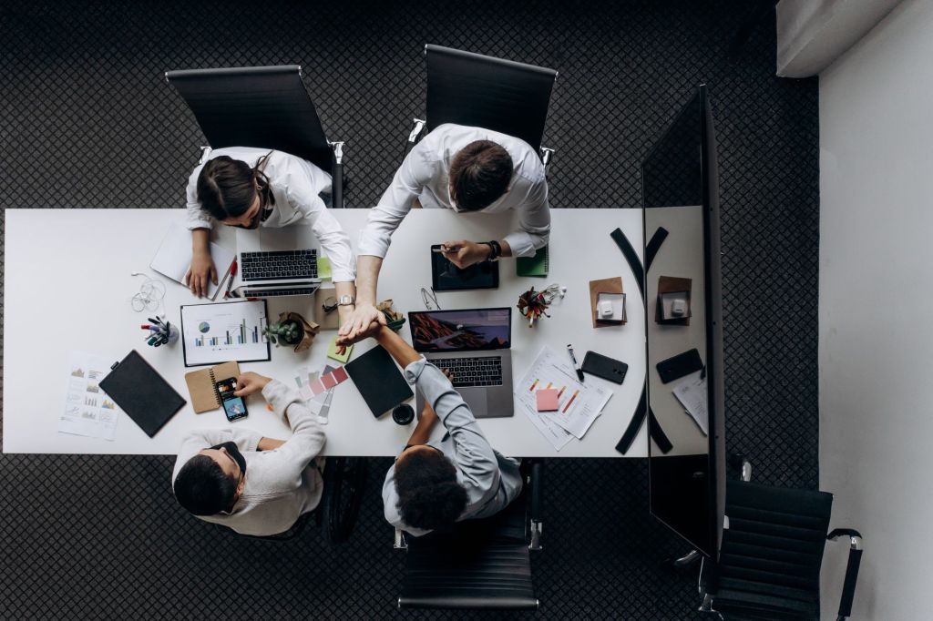 people sitting around the conference table